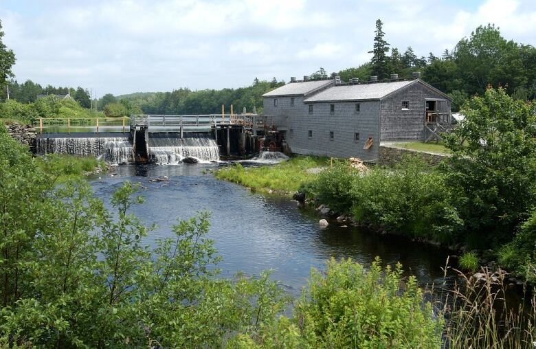 A sawmill and a museum are shown in an archival photo.