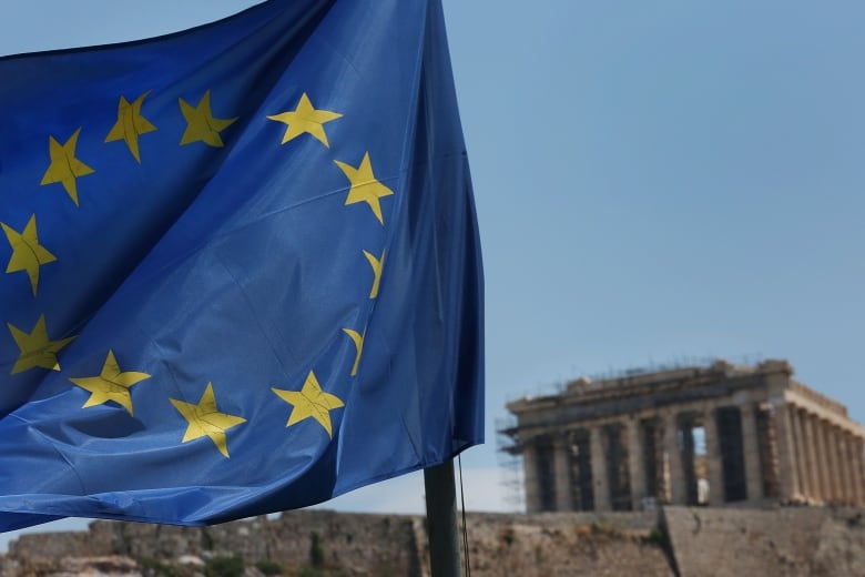 A flag of the European Union flies on the Acropolis hill, across the Parthenon, in Athens, Greece, 22 June 2018.