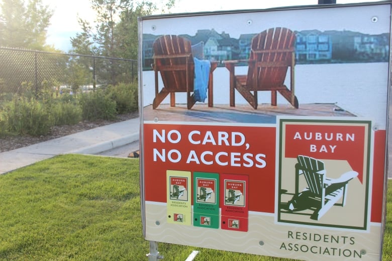 A sign telling visitors to the lake in the Calgary community of Auburn Bay: 'No card, no access.' Those are the rules of the Auburn Bay Residents Association, which restricts access to area residents who pay mandatory fees to help maintain the amenity.