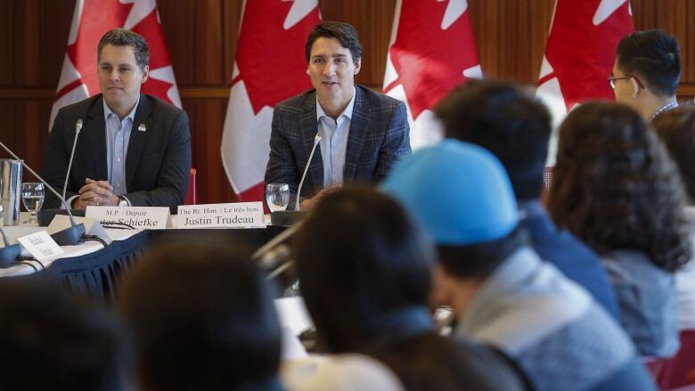 Prime Minister Justin Trudeau, centre, attends a meeting of the Prime Minister's Youth Council in Calgary on Wednesday, Jan. 25, 2017.