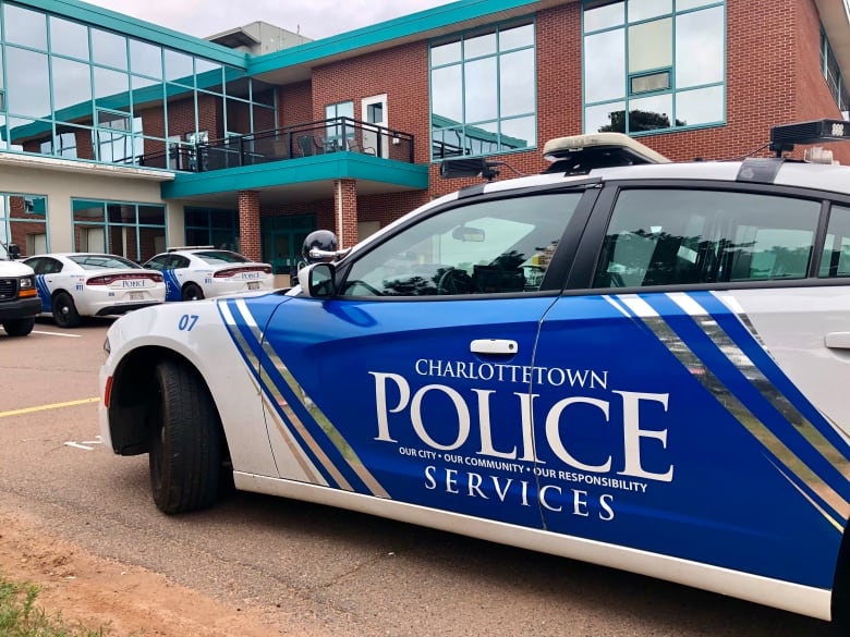 A branded police cruiser is parked outside the Charlottetown Police Services station.