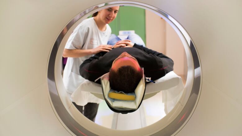 A patient entering a CT scanner is shown in this file photo.