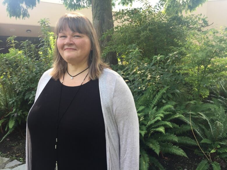 Photo shows a smiling First Nations woman