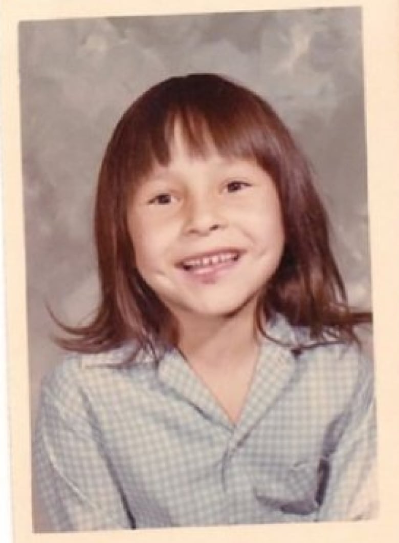 Photo of young girl smiling.