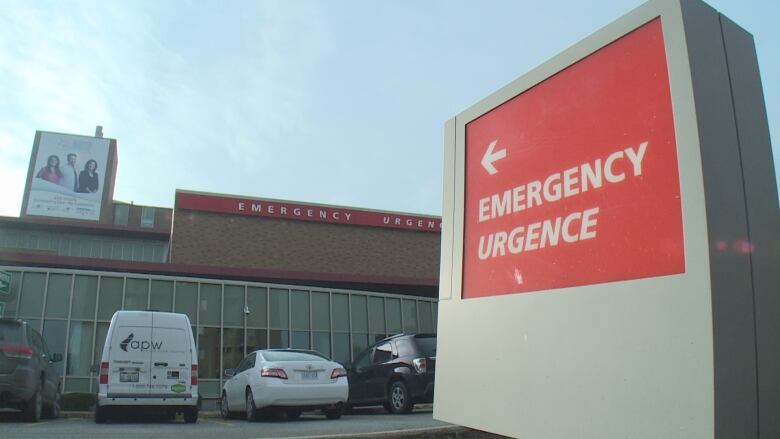 The exterior of a hospital building with sign that says 