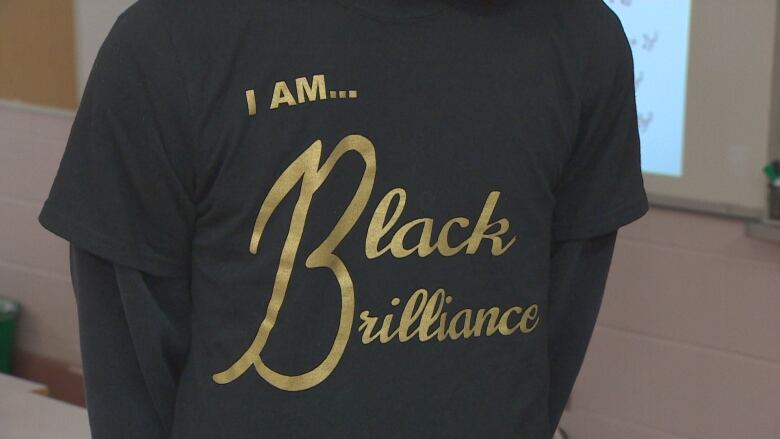 A black t shirt that reads 