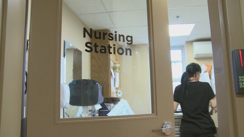 A door reads Nursing Station and a persons back is visible.