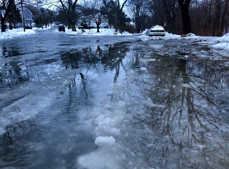 Water, slush and snow on a messy street.