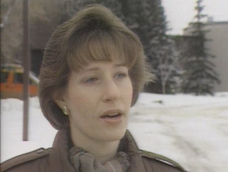 Woman with snow in background