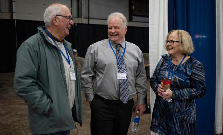 three people sharing a laugh