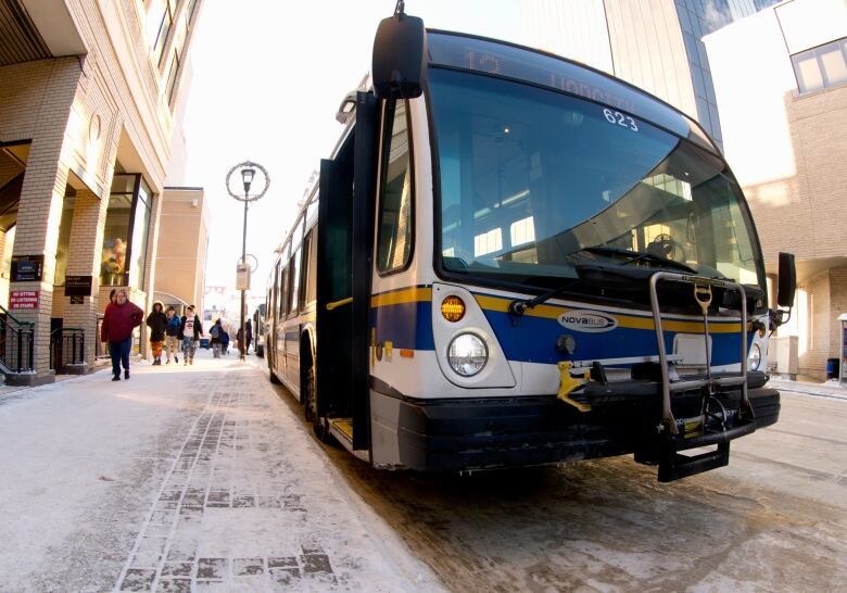 A Regina Transit bus stops to unload passengers on 11th Avenue in Regina. 