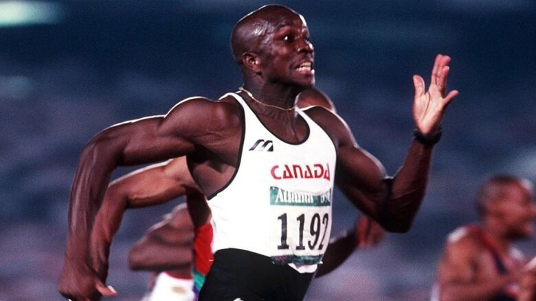 Donovan Bailey mid-run.