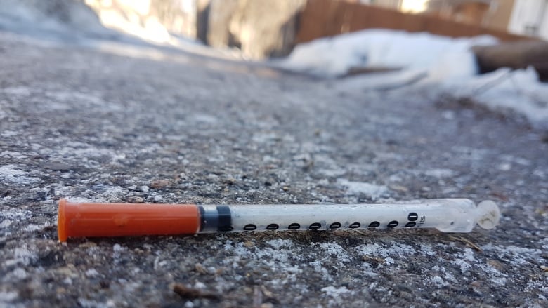 Meth need on Winnipeg West Broadway sidewalk during the winter time. 