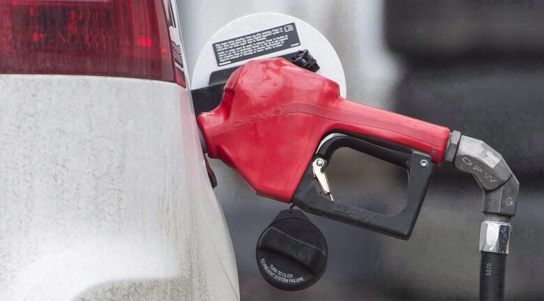 Gas pump inserted into car