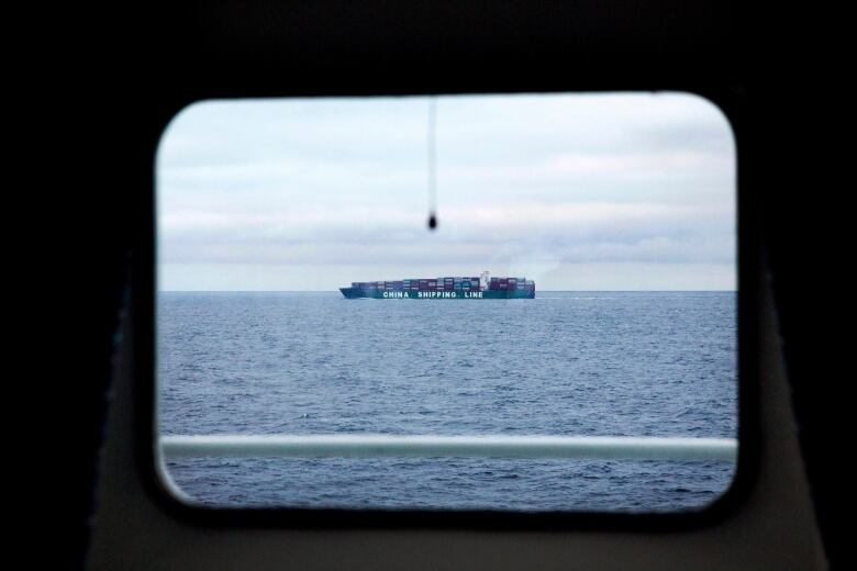 A China Shipping Line cargo ship sails sails the North Pacific Ocean off the coast of Alaska past the Finnish icebreaker MSV Nordica, Tuesday, July 11, 2017.