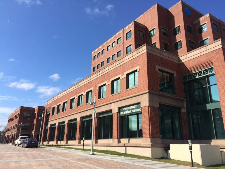 A red brick building with various corners and setbacks.