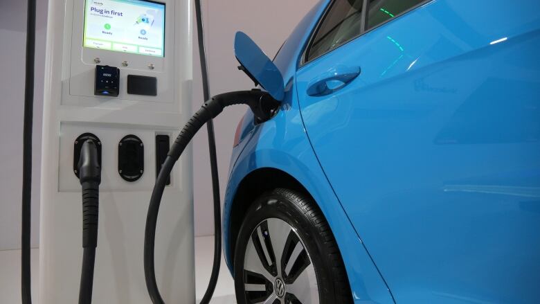 An electric vehicle charging station is seen at the Volkswagen display during the media day at the Canadian International AutoShow in Toronto, Ontario, Canada, February 14, 2019. REUTERS/Chris Helgren - RC11A364AF50