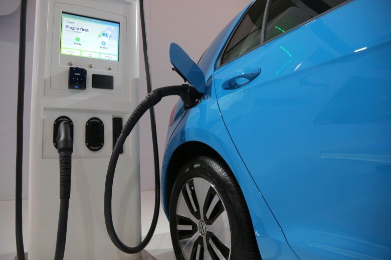 An electric vehicle charging station is seen at the Volkswagen display during the media day at the Canadian International AutoShow in Toronto, Ontario, Canada, February 14, 2019. REUTERS/Chris Helgren - RC11A364AF50