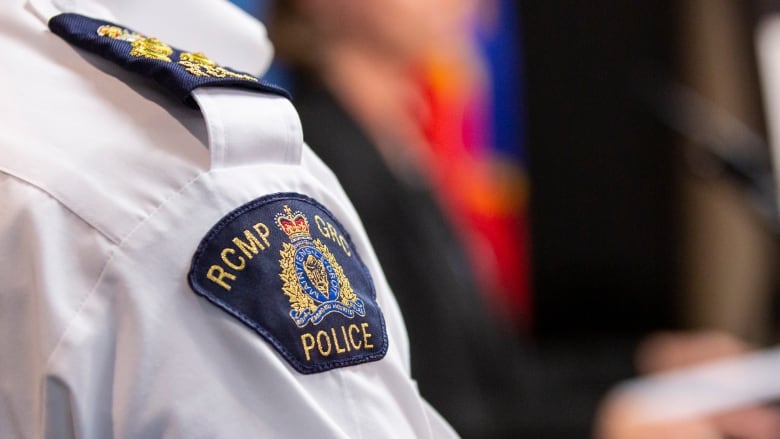 A police officer with his RCMP shoulder badge pictured.