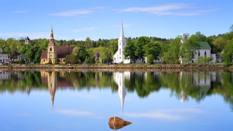 small town reflection in ocean