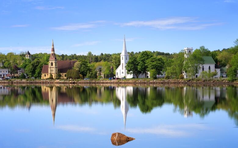 small town reflection in ocean