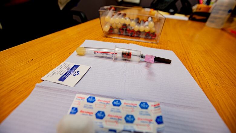 Items of a blood test kit lying on a table.