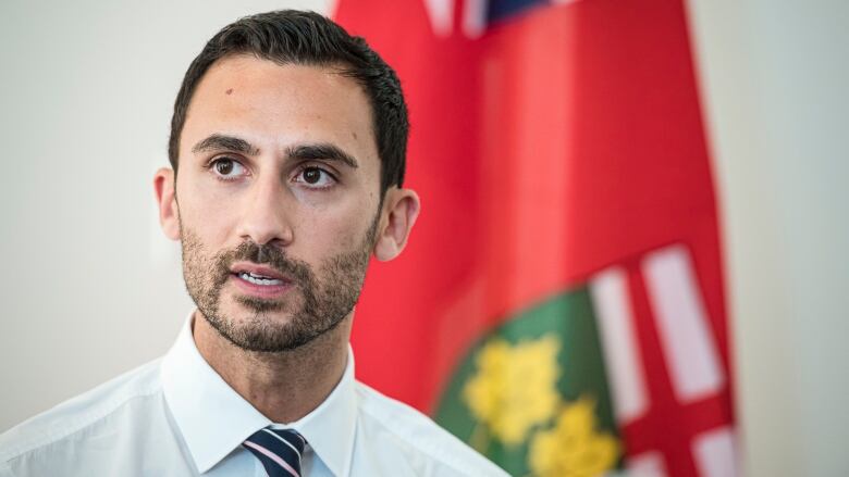 Ontario Minister of Education Stephen Lecce speaks to teachers before giving remarks, in Toronto, on Aug. 22, 2019.