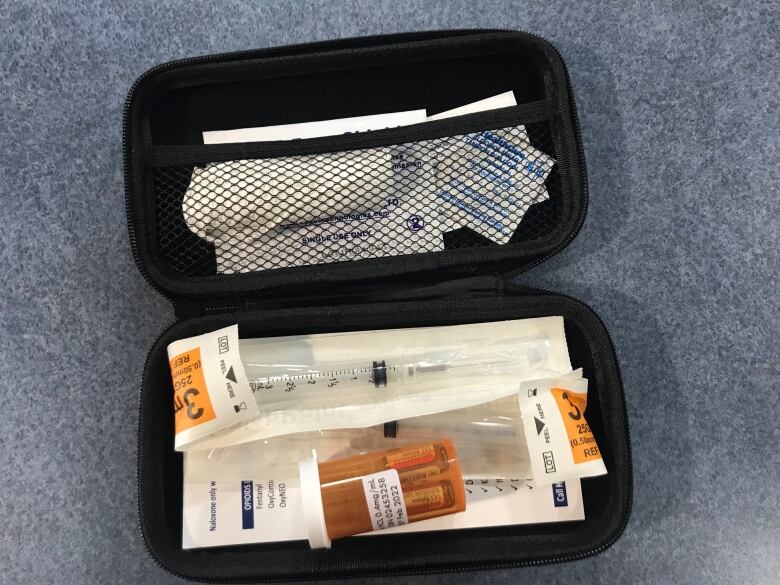 A naloxone kit is pictured.