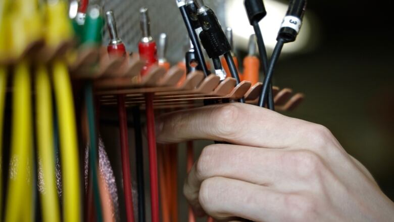 A person doing electrical work.