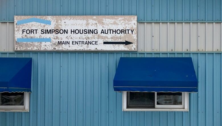 A blue building with a sign that says Fort Simpson Housing Authority 