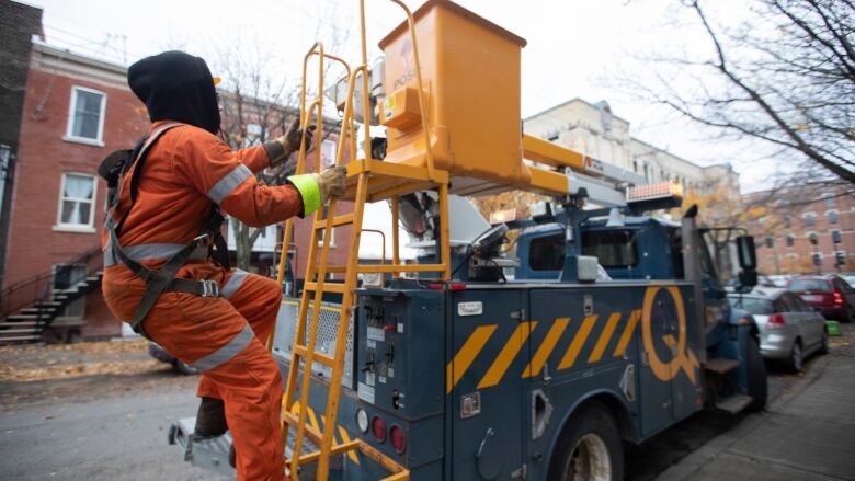 A Hydro-Quebec crew member on a truck. 