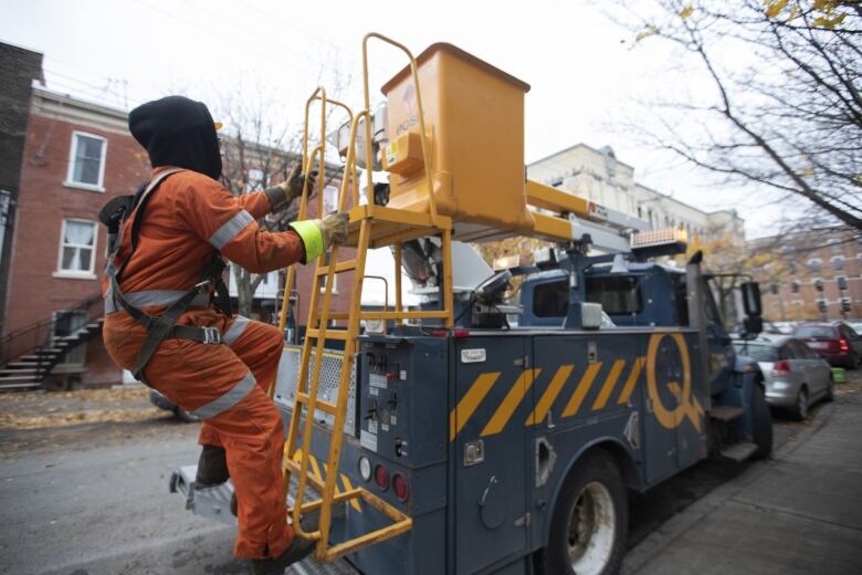 A Hydro-Quebec crew member on a truck. 