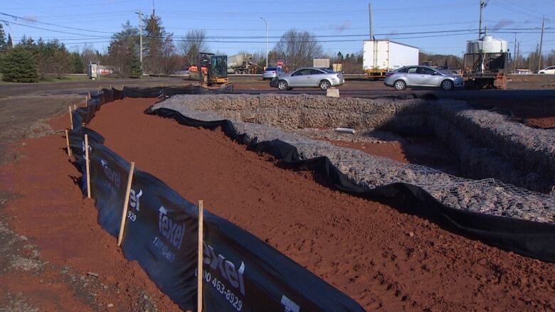 Rock and cloth barriers holding soil in place at a construction site. 