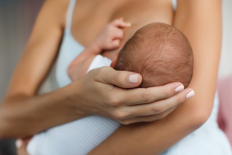 Mother breastfeeding her child.