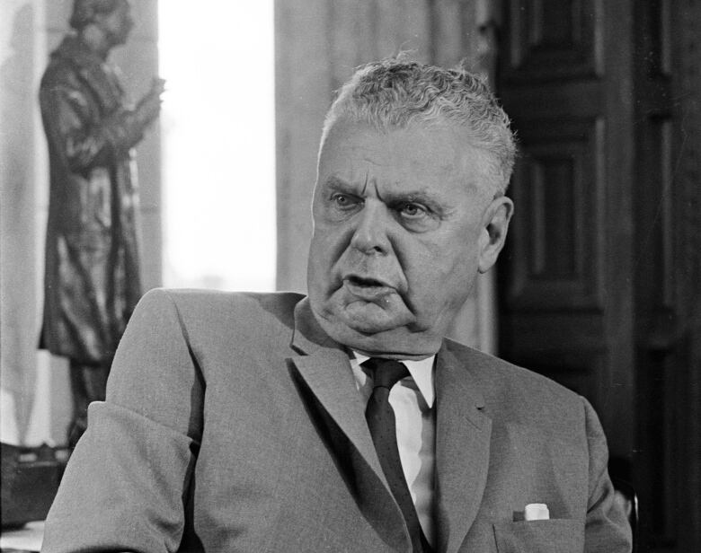 Man sitting behind desk