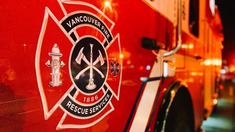 A close-up of the crest for the Vancouver Fire Rescue Services on the side of one of the service's engines,