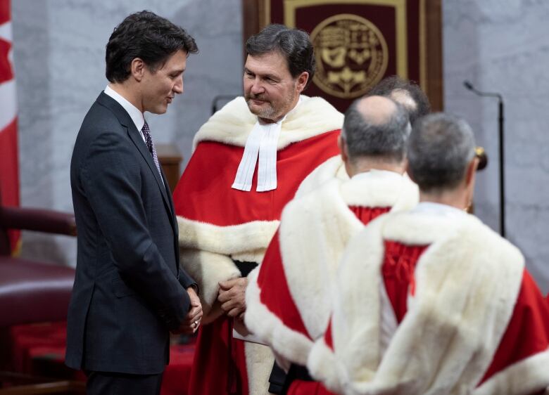 Prime Minister Justin Trudeau speaks with Supreme Court Chief Justice Richard Wagner as they wait for the Speech from the Throne to begin, Thursday December 5, 2019 in Ottawa. 