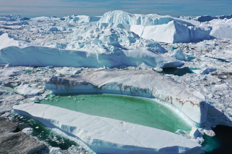 A shot of meltwater on an ice cap in Greenland.