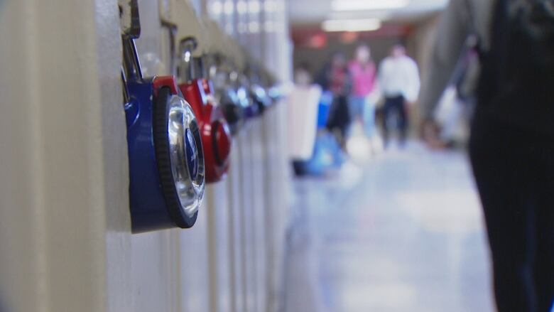 A row of high school lockers are pictured.