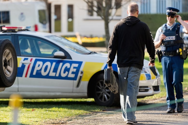 A gun owner hands in his firearms at Riccarton Racecourse on July 13 in Christchurch. The Christchurch event was one of hundreds of events that ran across the country over after the New Zealand government banned semi-automatic weapons in April.