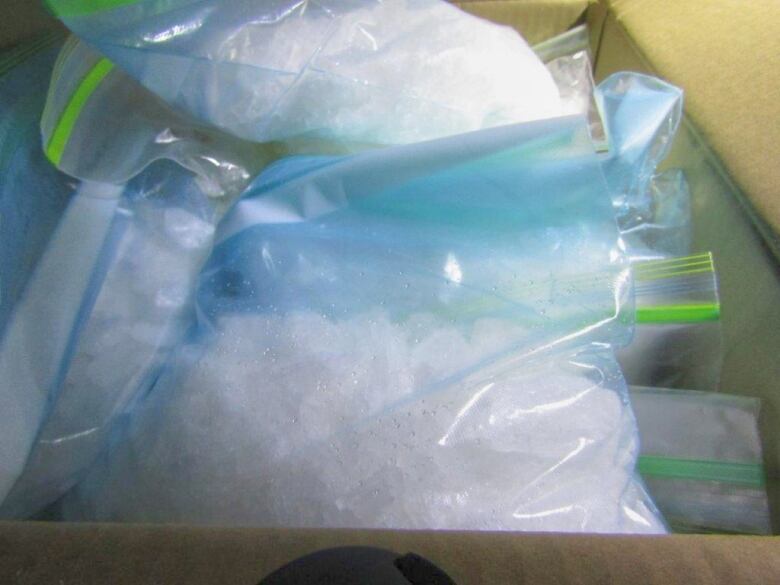 Plastic bags filled with white crystals.