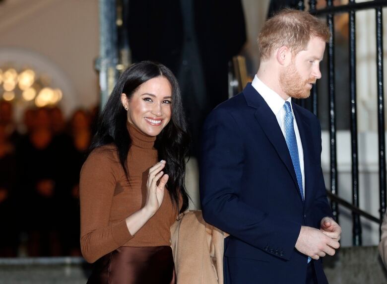 Prince Harry and Meghan Markle are photographed. 