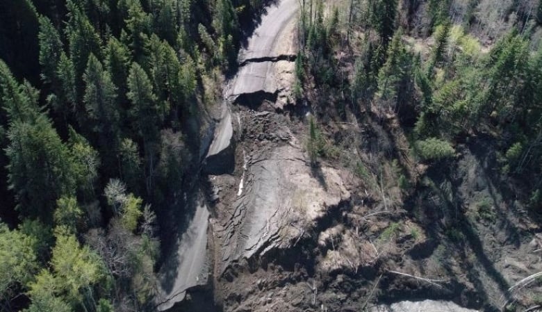 An aerial view of a destroyed road.