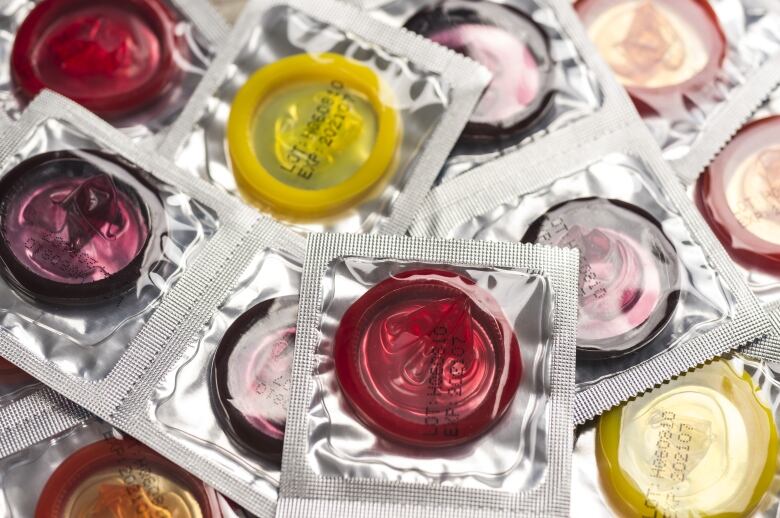 Many colourful condoms in packages