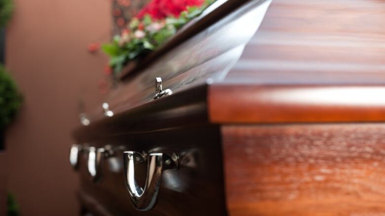 The side view of a funeral casket.