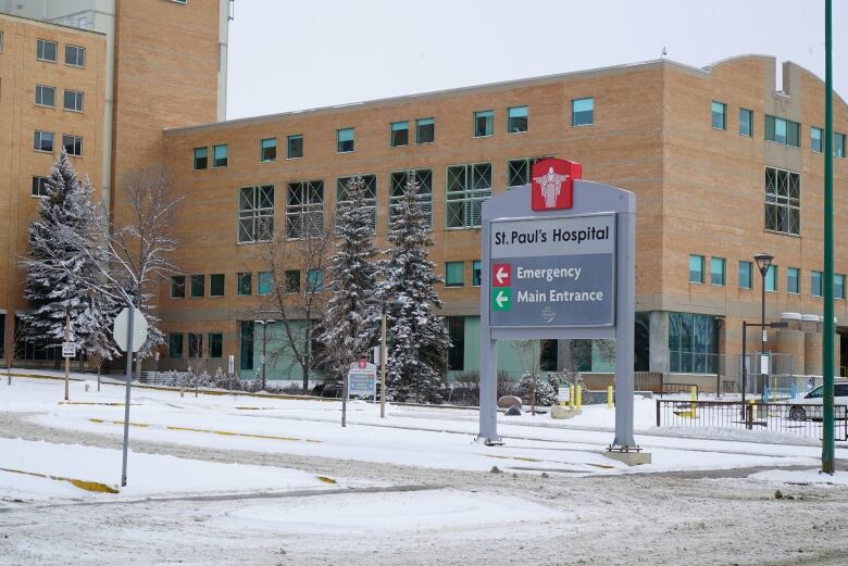 A large brick building, with a sign that says 