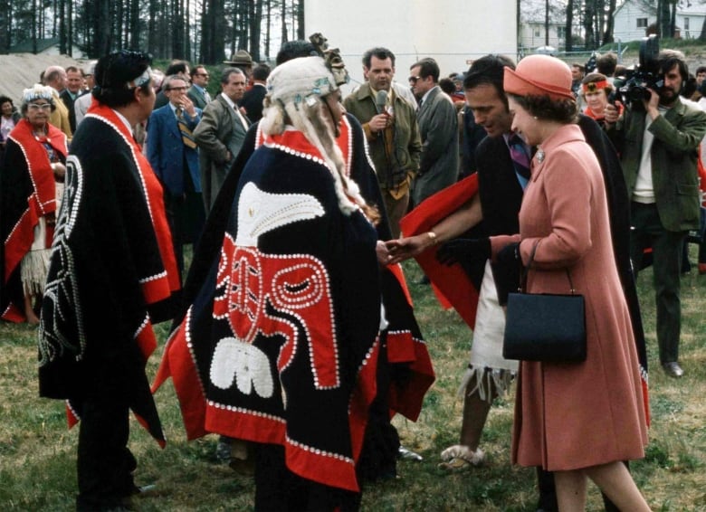 Man in traditional Indigenous cape