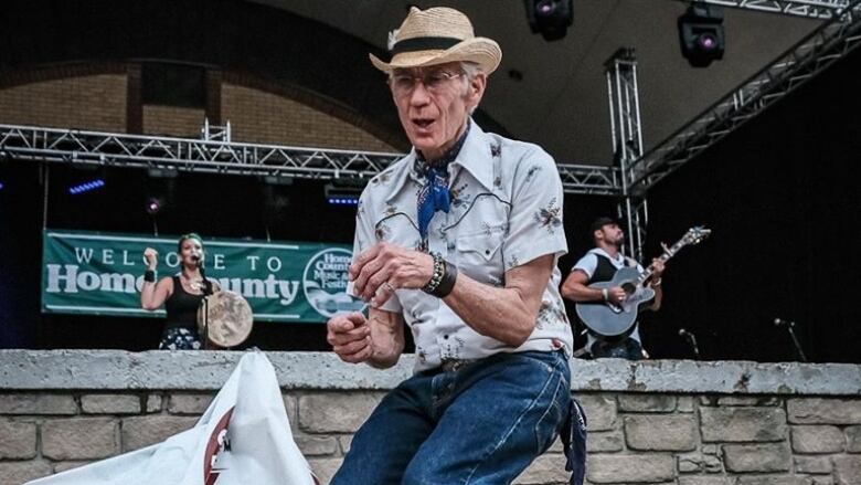 Londoner Bev Camp, also known as the Dancing Cowboy, shakes it up at the Home County Music and Arts Festival. 