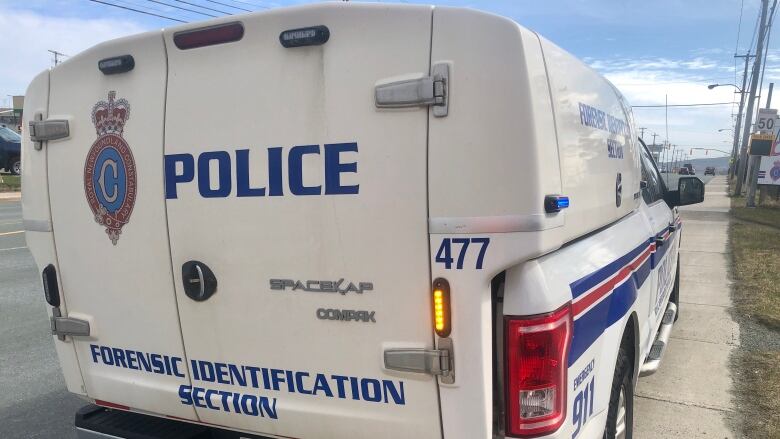 A photo of the back of a police forensics investigation van.