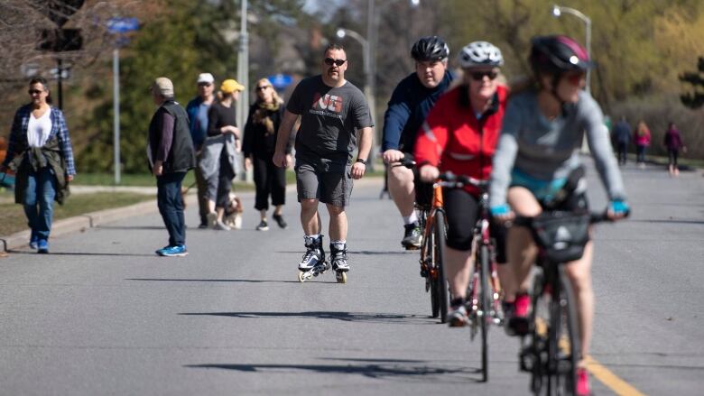 People walk, ride bikes and inline skate on Queen Elizabeth Drive in Ottawa.